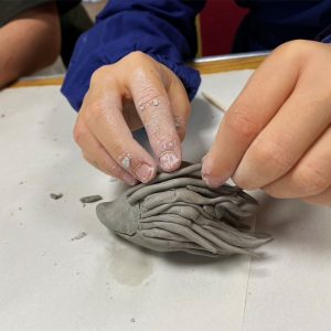 Child making toy.